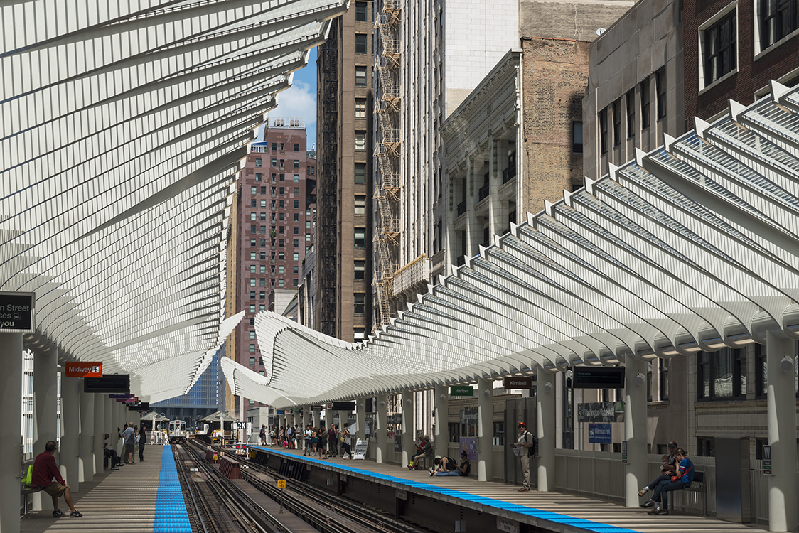 A train station with a lot of people on it.