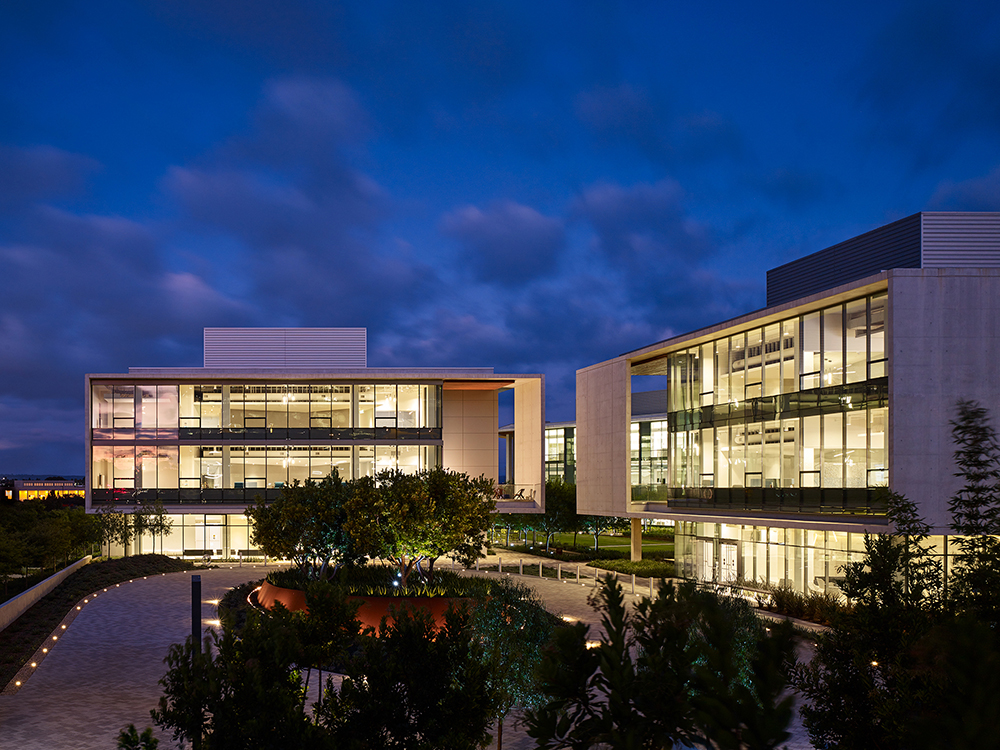 An office building lit up at night.