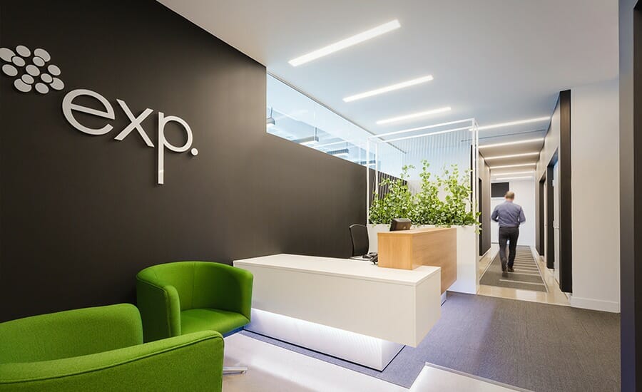 An office with a green chair and a sign that says exp.