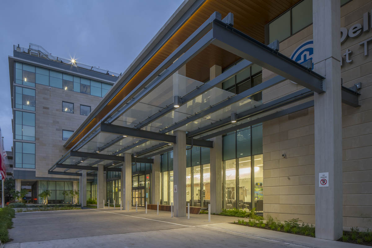 The entrance to a healthcare building at dusk.