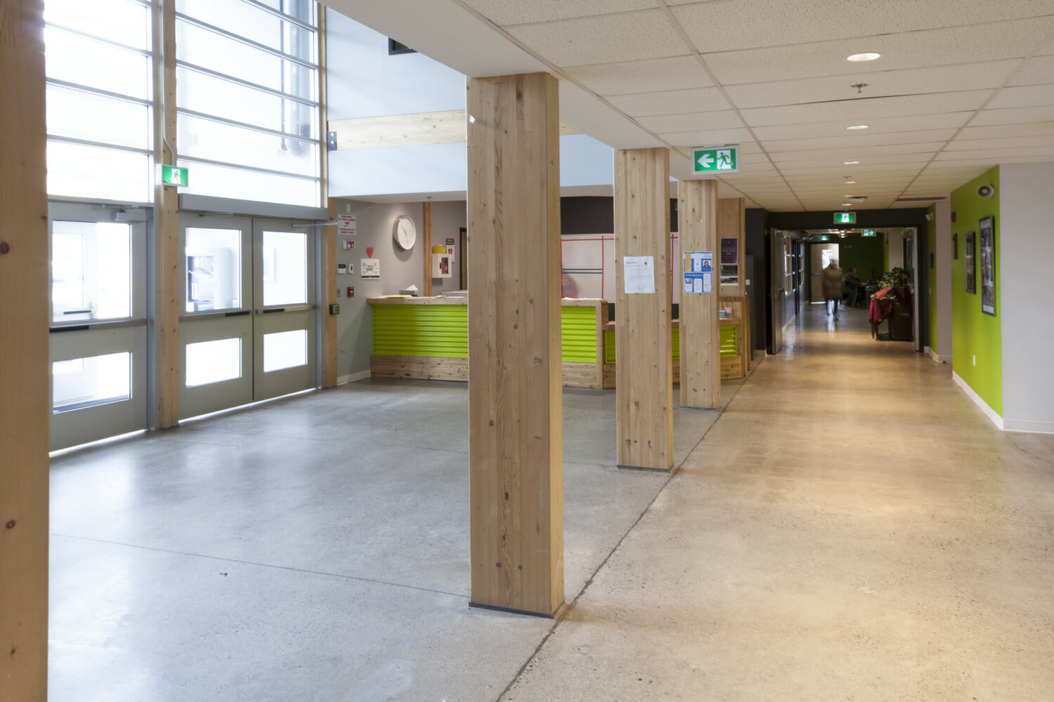 A hallway with wooden pillars.