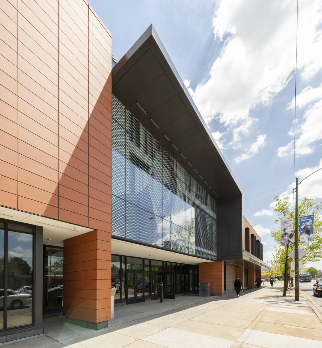 The exterior of a building with a glass facade.