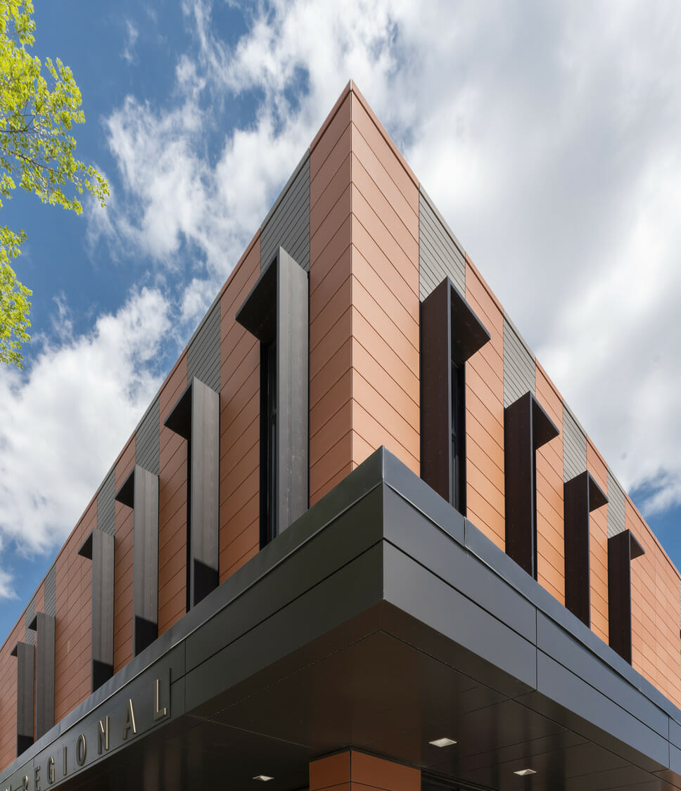 The exterior of a building with a metal roof.