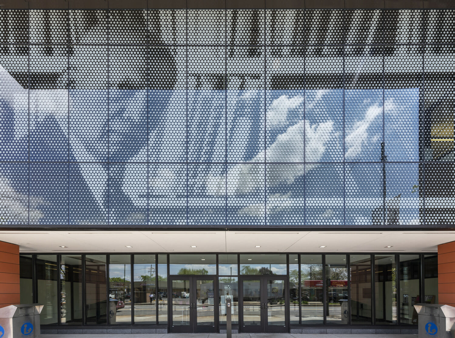A building with a glass facade and a picture of a man.