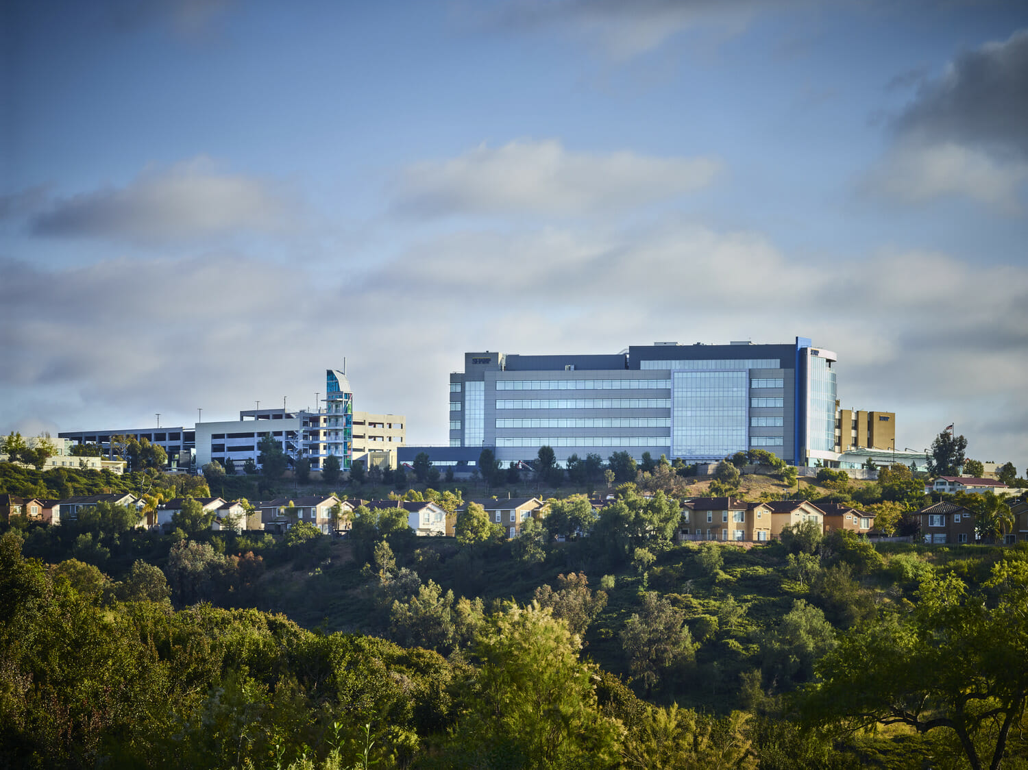 An EXP healthcare building sits atop a hill.