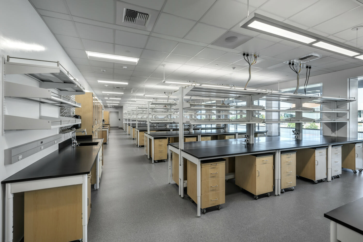 A technology lab with a lot of tables and shelves.