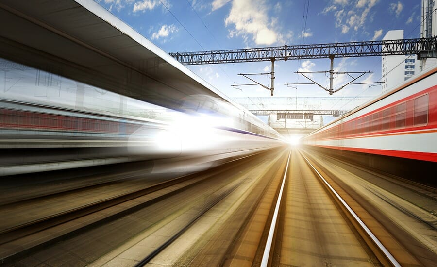 An EXP train traveling through a train station.