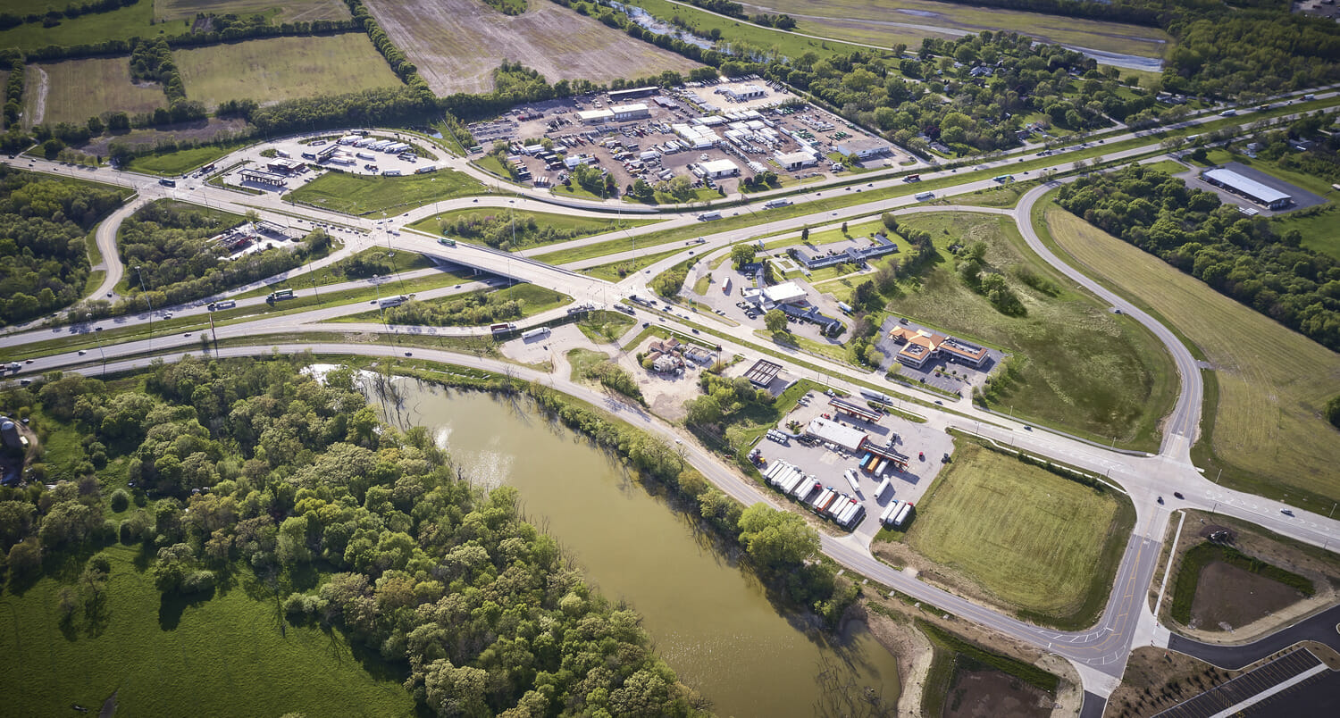 An aerial view of a highway intersection undergoing construction.