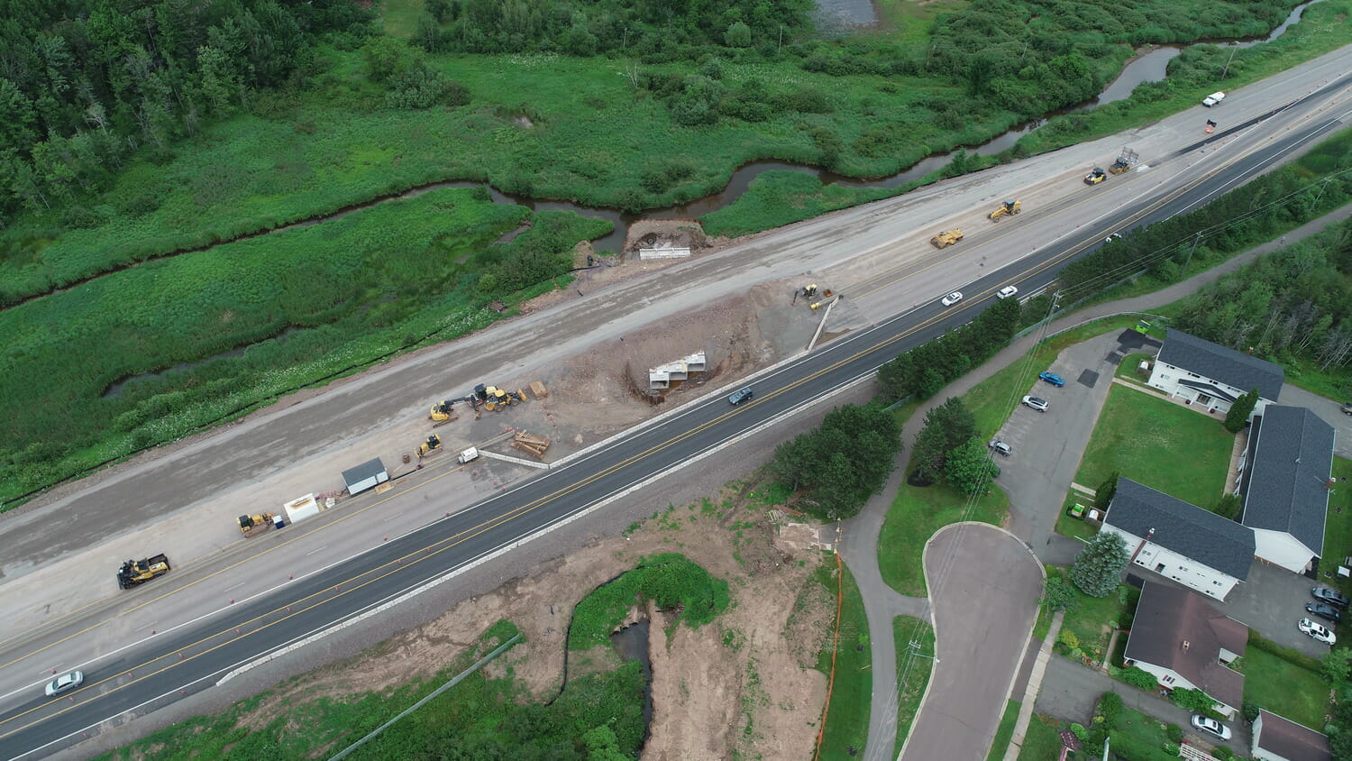 An aerial view of construction on a highway involving culvert installation.
