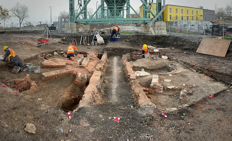 A group of workers are working on a construction site.