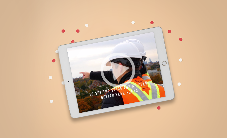 An ipad with a man in a hard hat pointing at something.