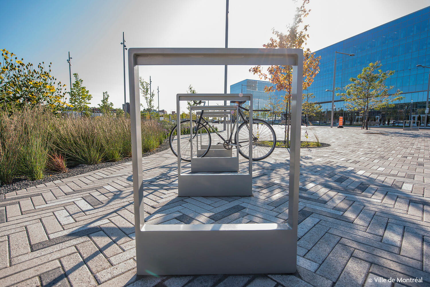 A bike rack with two bicycles on it.