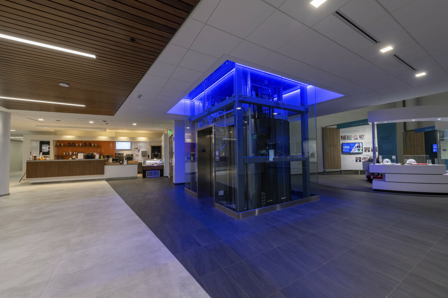 The lobby of a hospital with blue lighting.