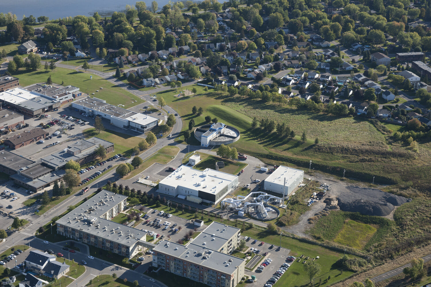 An aerial view of a campus with buildings and trees.