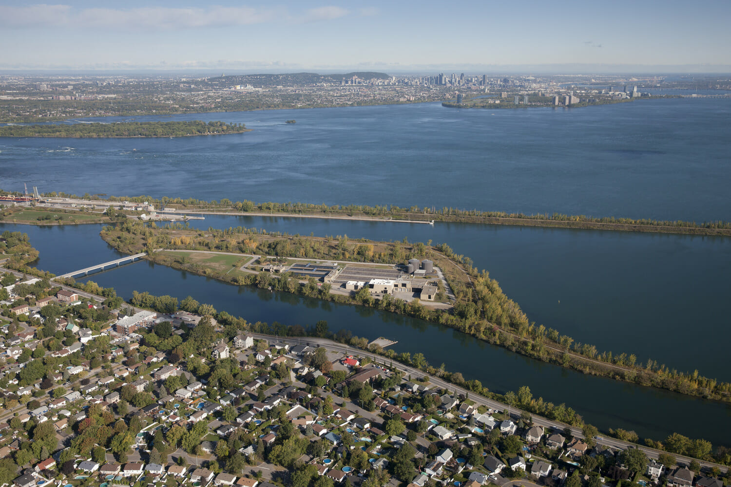 An aerial view of a city with a large body of water.