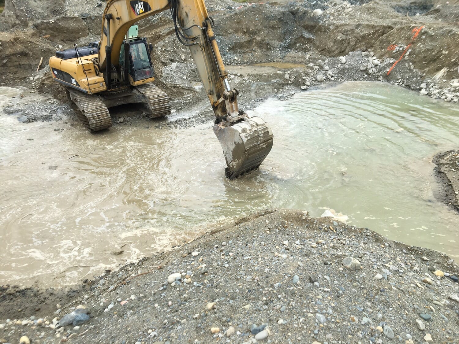 A bulldozer is digging a hole in the ground.