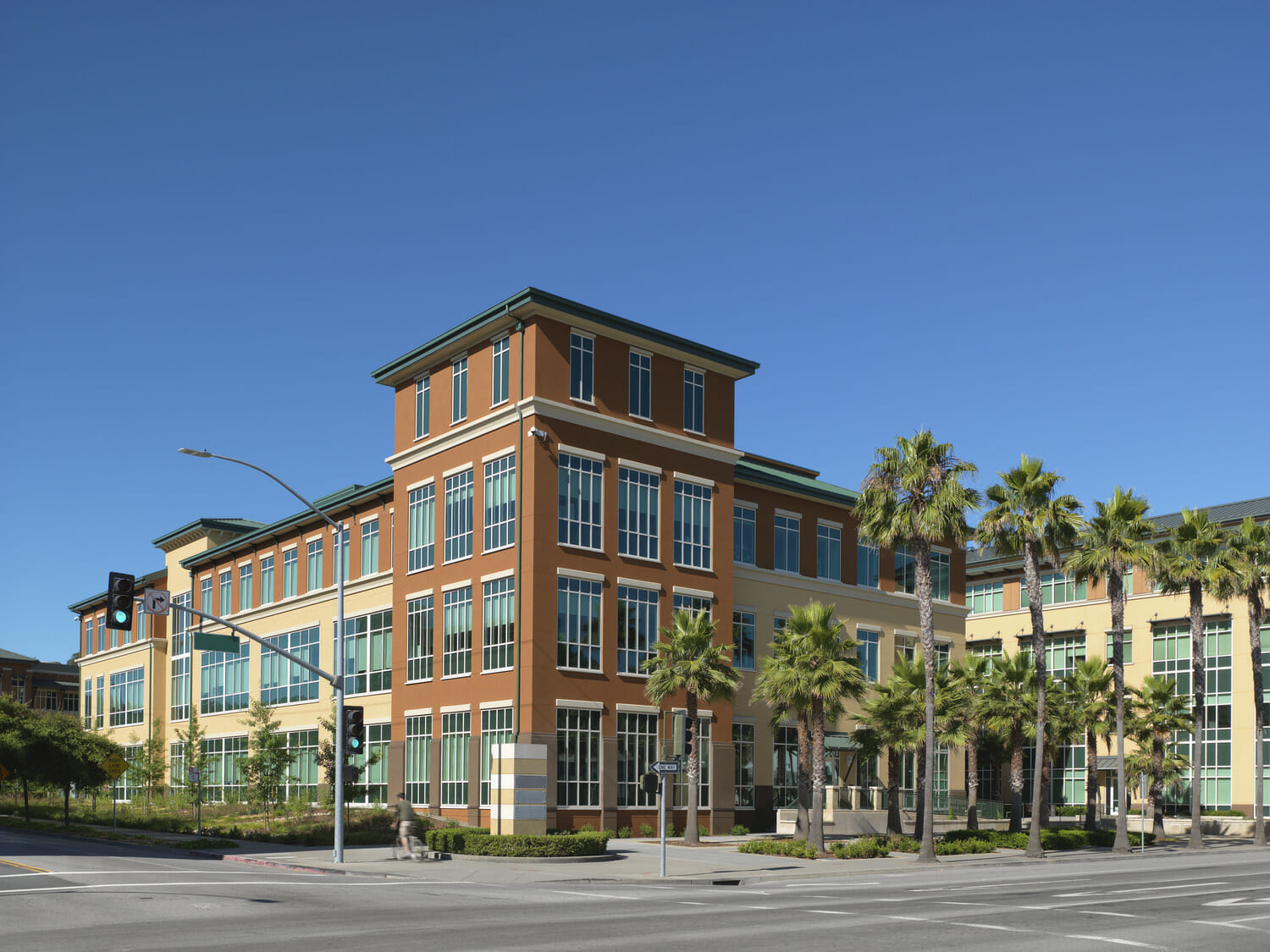 A large building in the middle of a street.