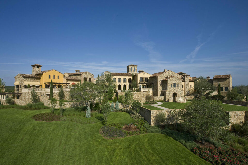 An aerial view of a large mansion.