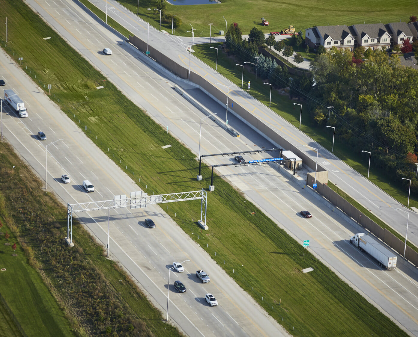 An aerial view of a highway with cars driving on it.