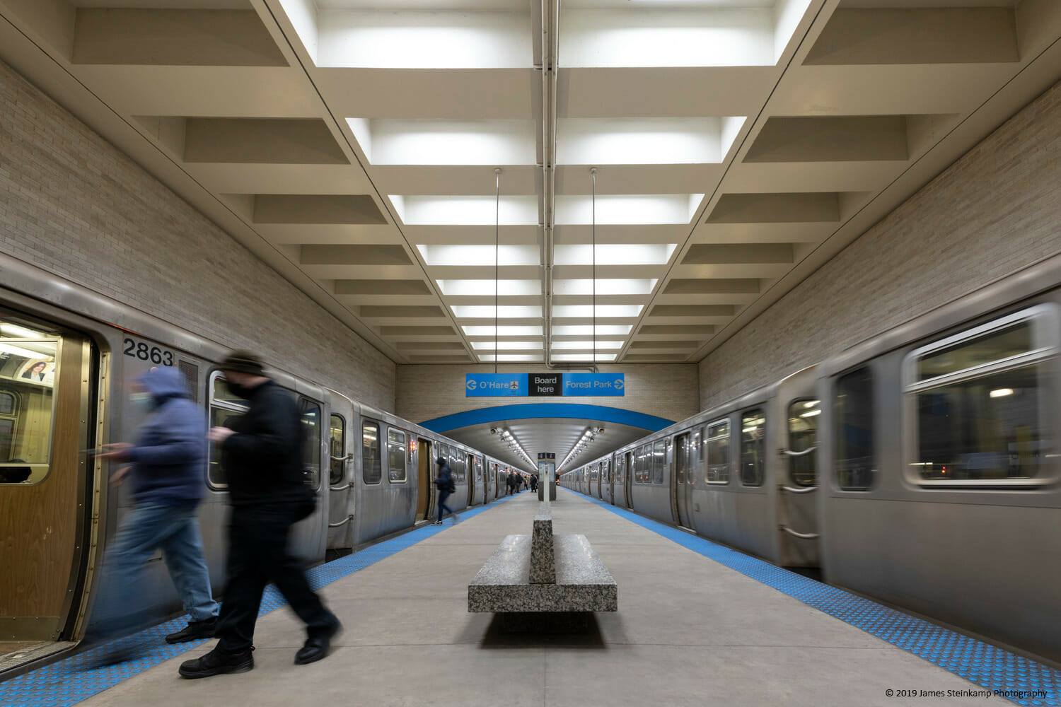 A subway train in a subway station.