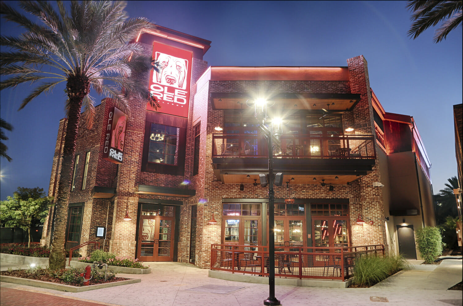 A restaurant is lit up at night.