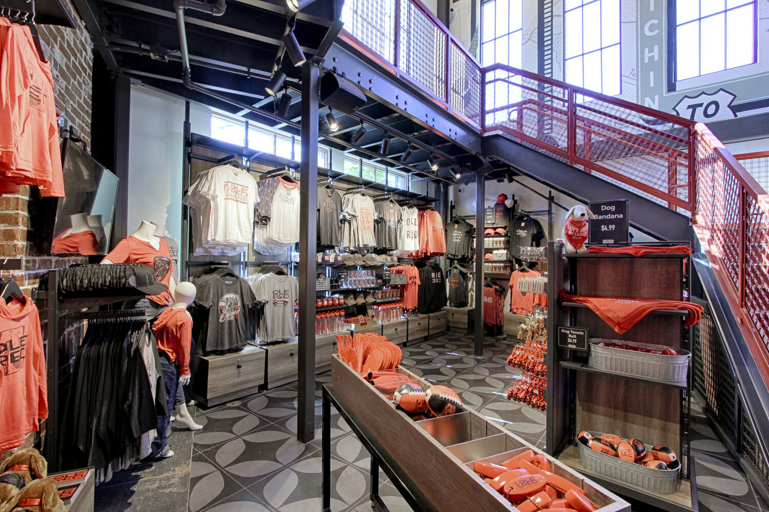 A store full of orange shirts and hats.