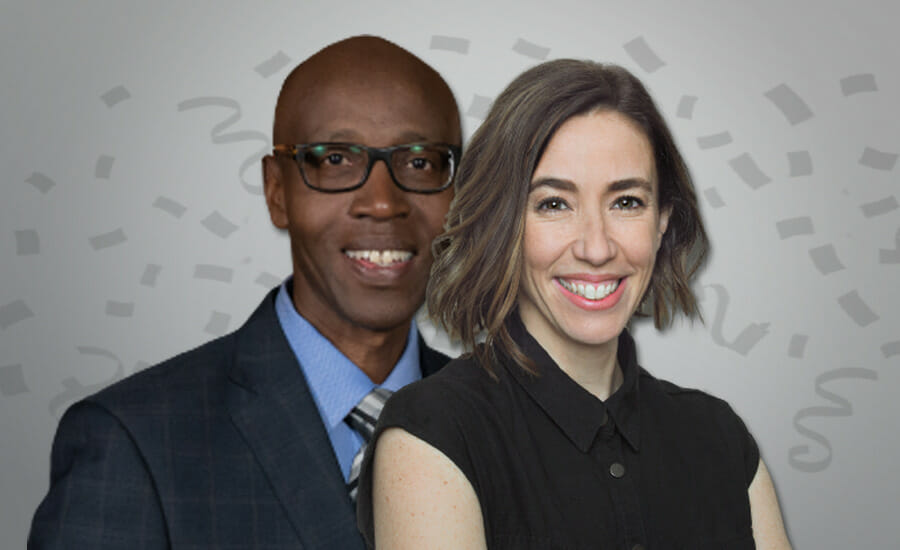 A man and woman smiling in front of confetti.