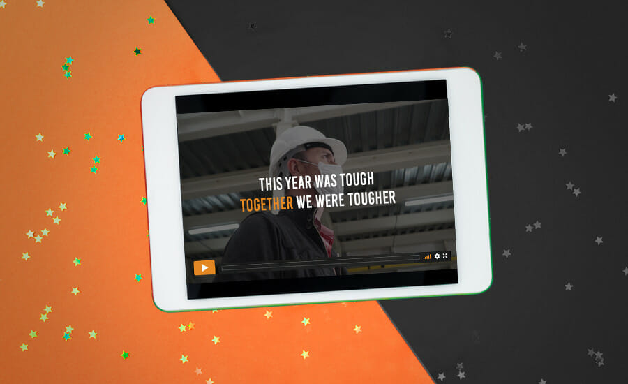 A tablet with an orange background and a man in a hard hat.