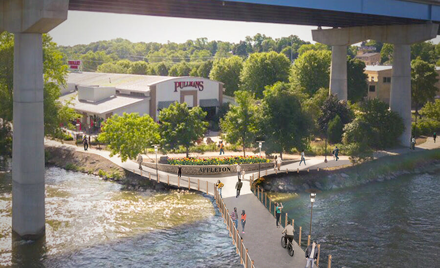 An aerial view of a pedestrian bridge over a river.