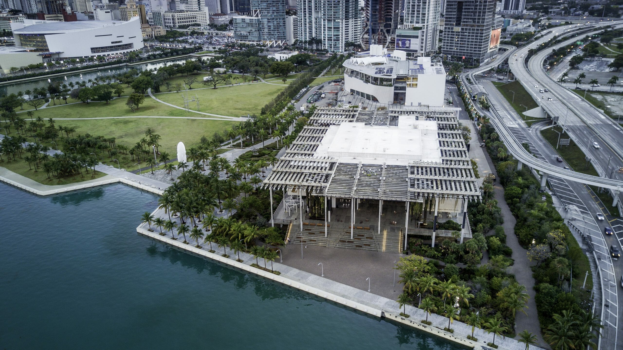 An aerial view of a building near a body of water.