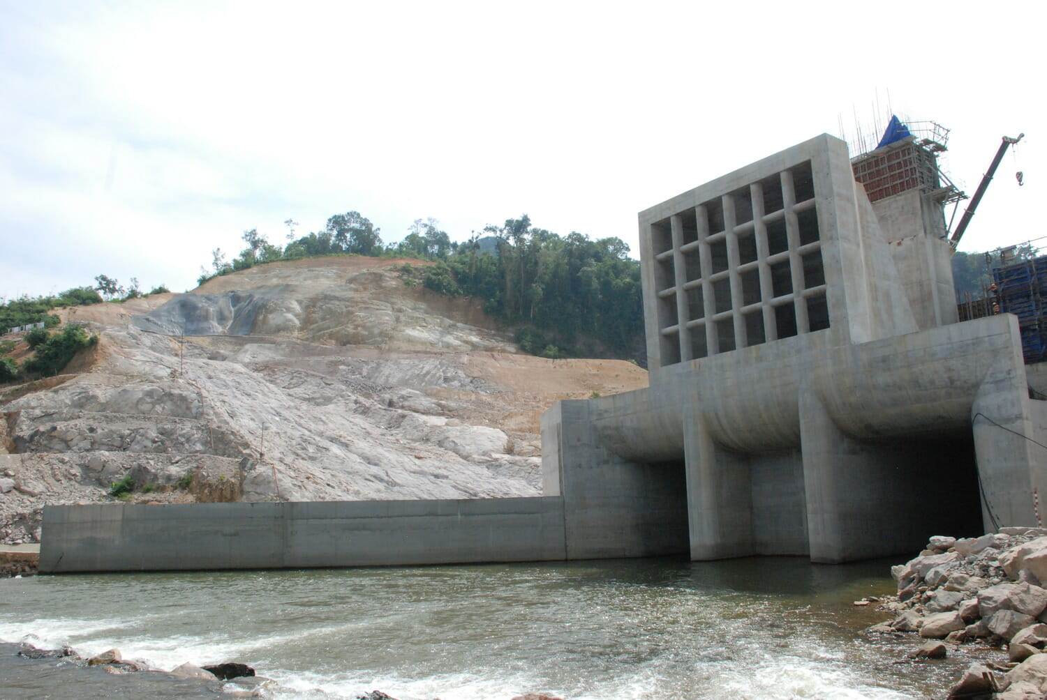 A concrete dam on a river.