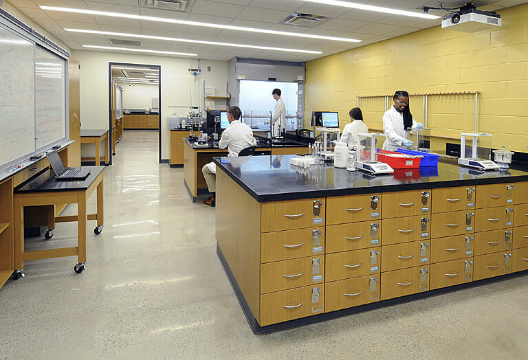 A group of people working in a lab.