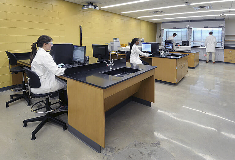 A group of people working in a lab.