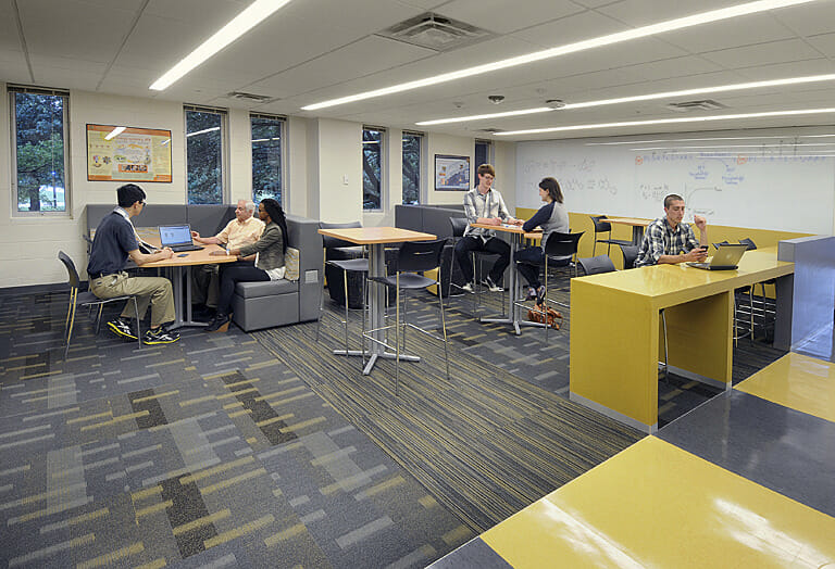 A group of people sitting at a table.