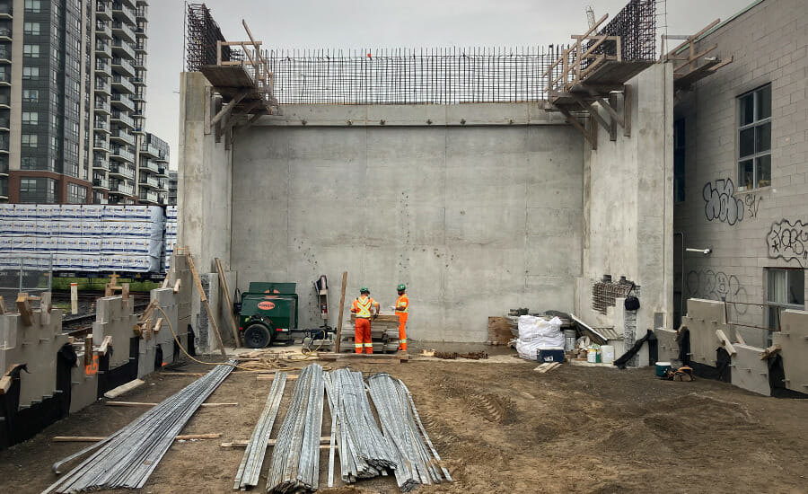 The construction of a concrete wall on a building.