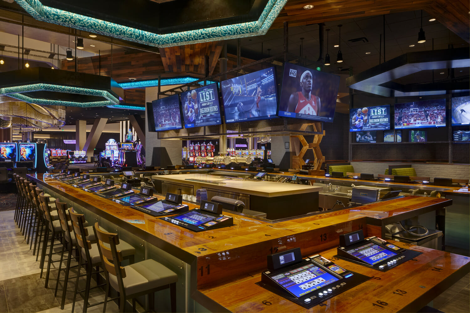 A sports bar with a large number of televisions.