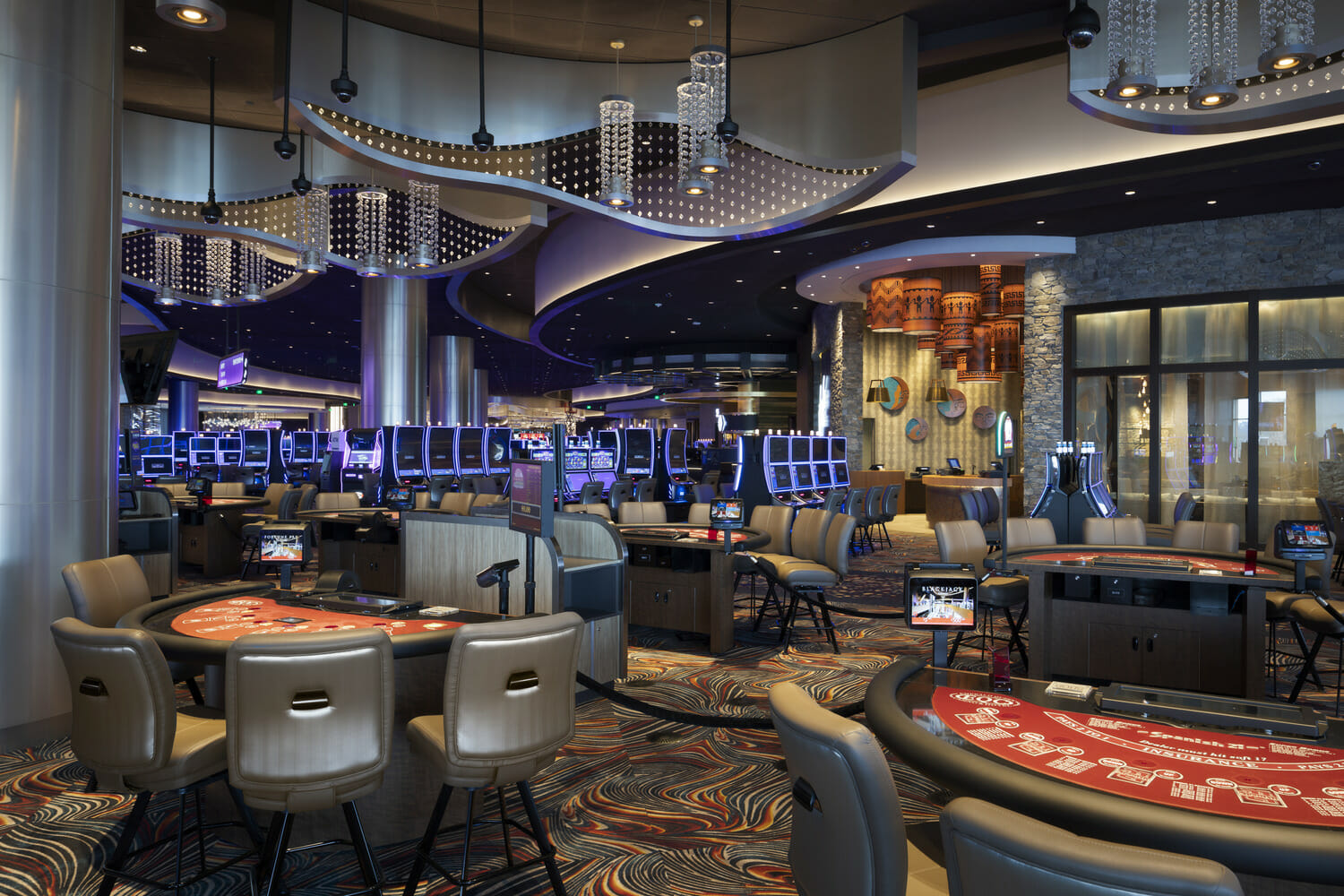 A casino with tables and chairs.