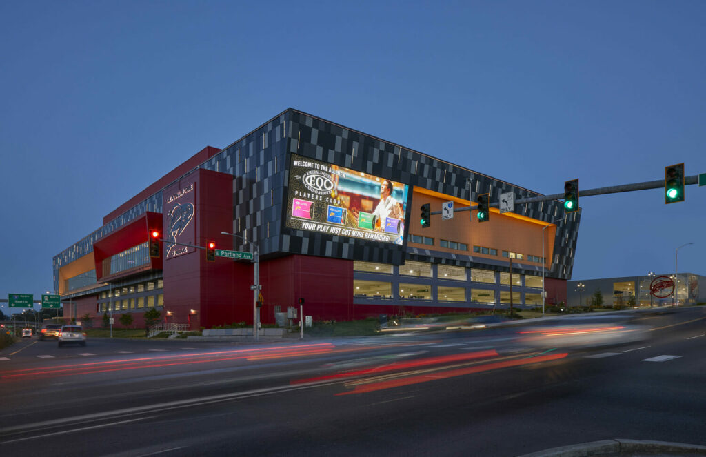 A red and black building with a sign on it.