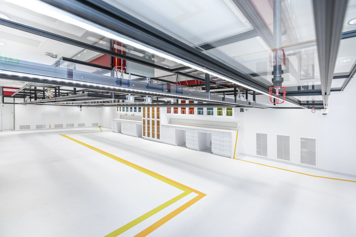 The interior of a building with a lot of pipes and wires.