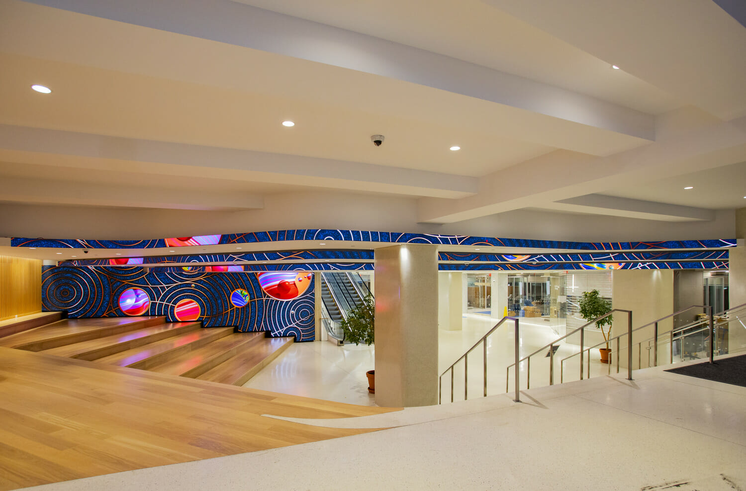 A wooden floor in a lobby.