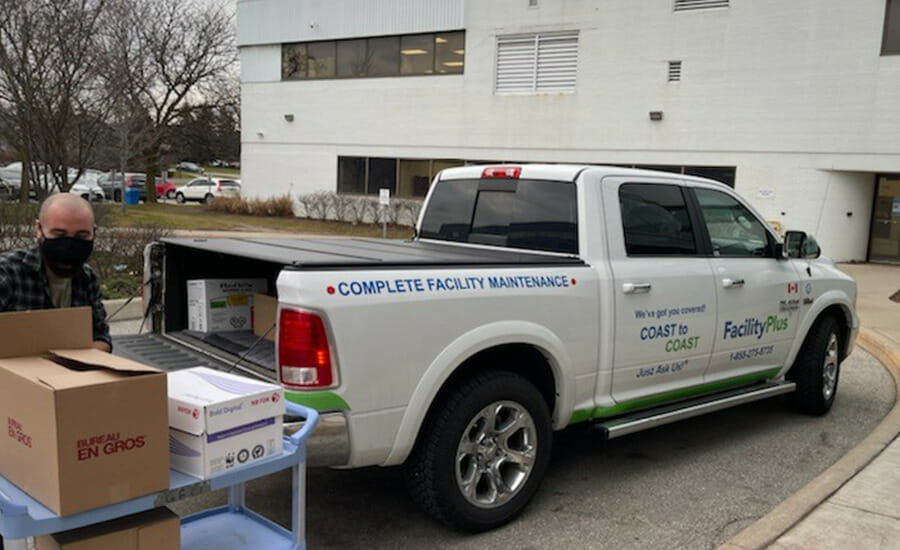 A man loading boxes into a truck.