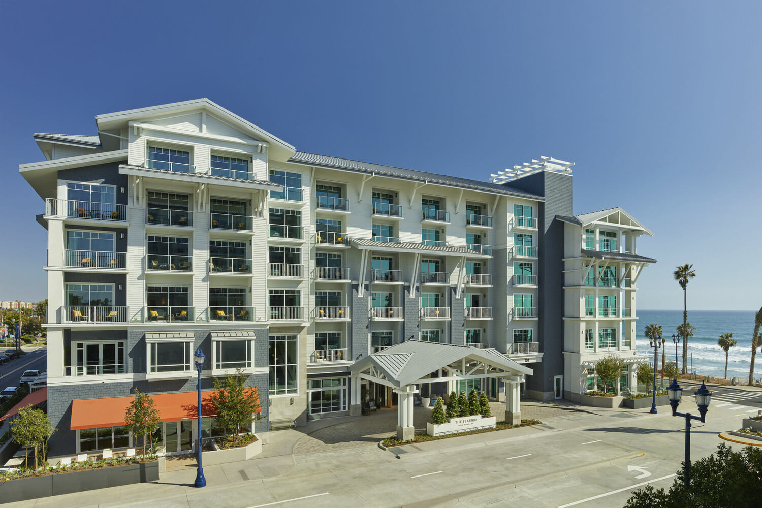 An apartment building with a view of the ocean.