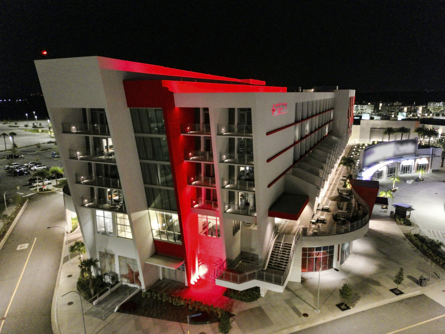 An aerial view of a hotel at night.
