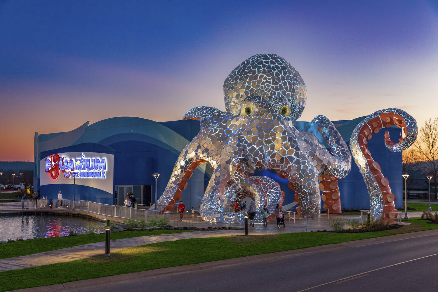 An octopus sculpture in front of a building.