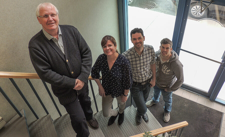 A group of people standing on stairs in a building.