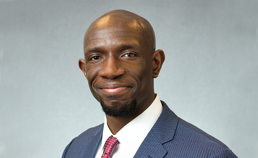 A black man in a suit and tie.