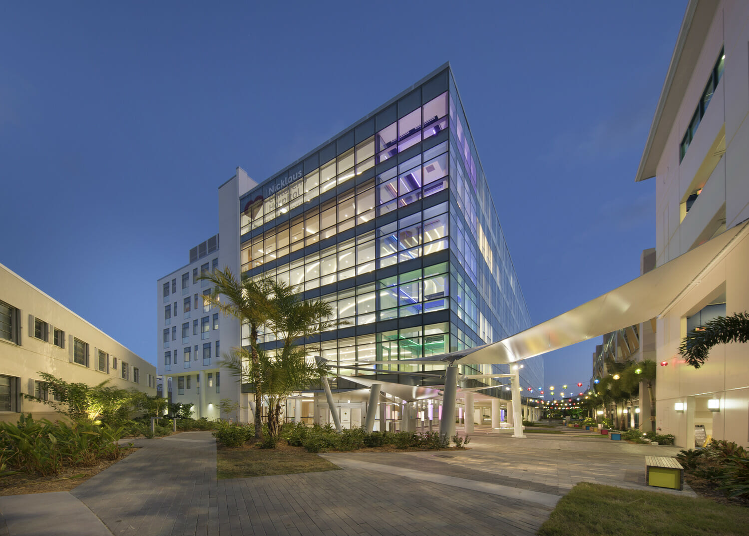 The exterior of a modern building at dusk.