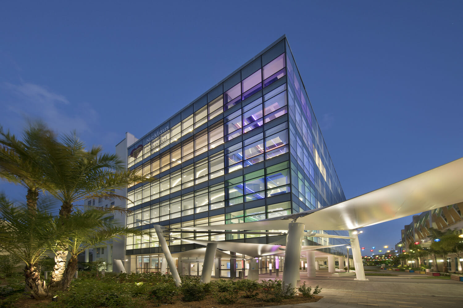 The exterior of a building lit up at night.