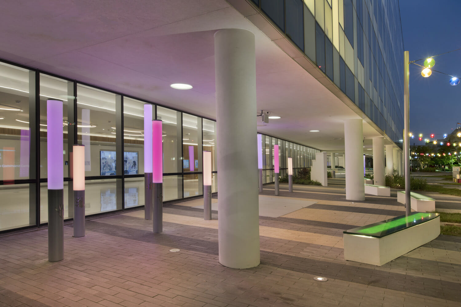 The entrance to a building is lit up at night.