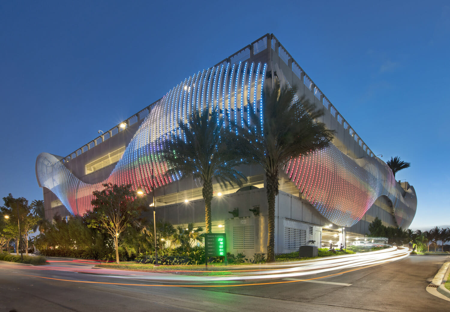 A building with a colorful facade at night.